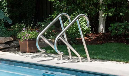 Pool with a silver railing to exit or enter on